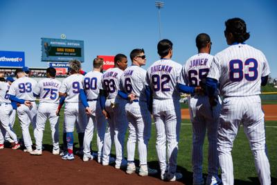Chicago Cubs right fielder Matt Shaw (6) stands with other players during the national anthem before the Cubs play the Texas Rangers in a Cactus League game at Sloan Park Saturday Feb. 21, 2026 in Mesa, Ariz.