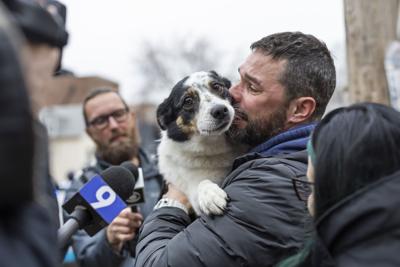 Nicholas Iwaniuk and his wife, Amanda Gratzianna, talk after they were reunited with their dog, Shadow, in an alley near North Lakewood and West Oakdale avenue on March 3, 2026.